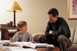 Picture of Father and Son doing Homework