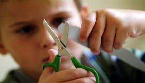 Picture of child Cutting Paper